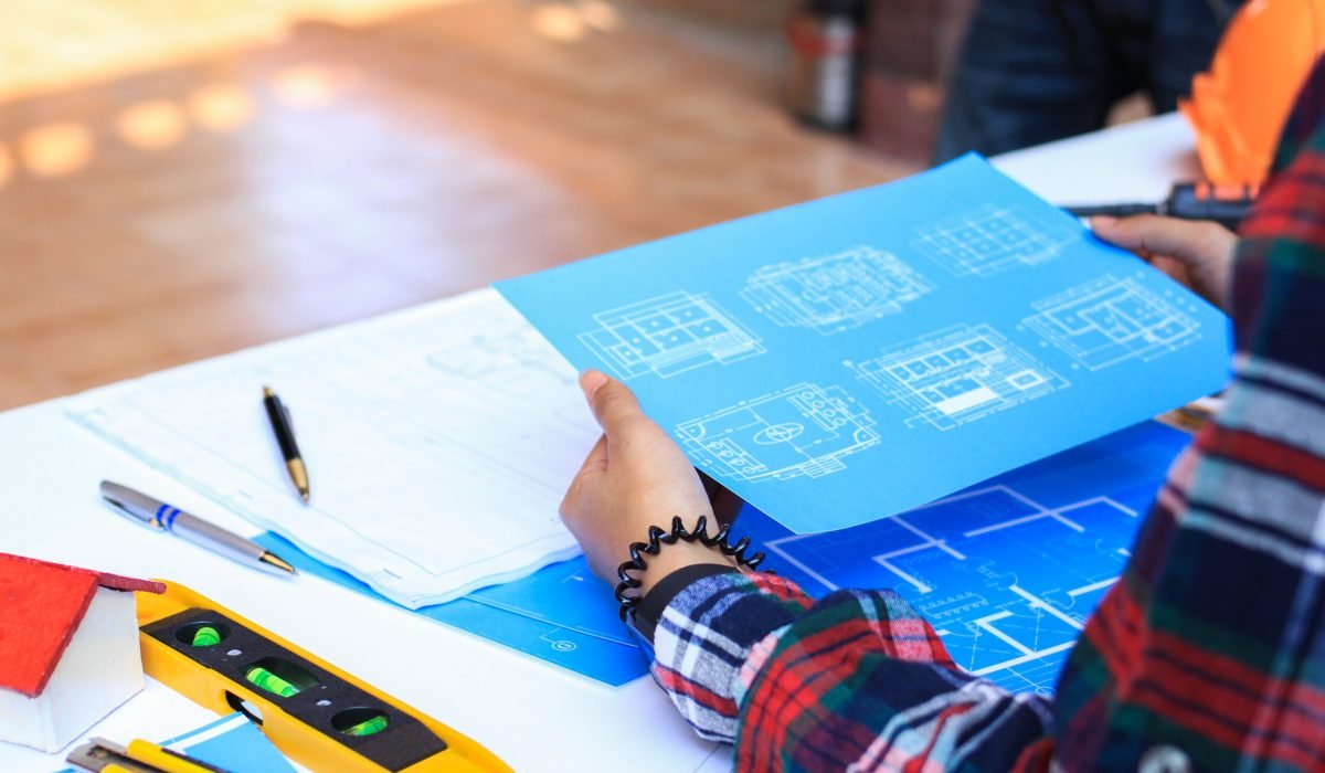 Engineers are meeting to discuss the design of a residential pro Engineers are meeting to discuss the design of a residential project.concept