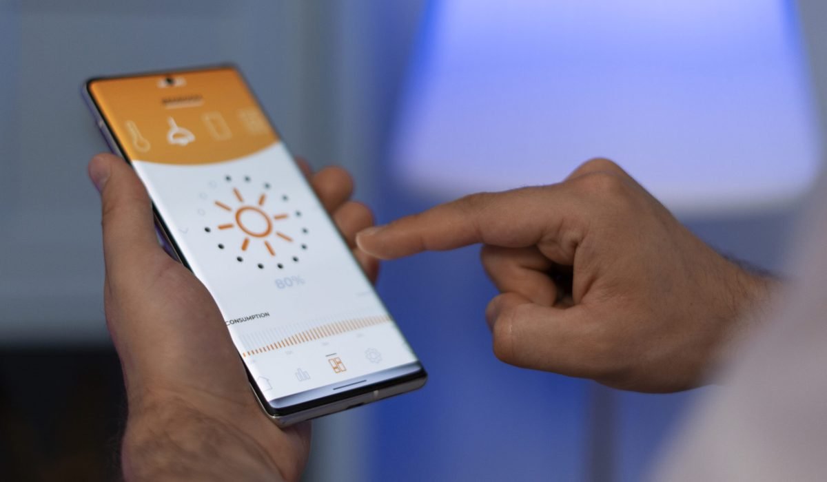 hand-holding-smartphone-home hand-holding-smartphone-home